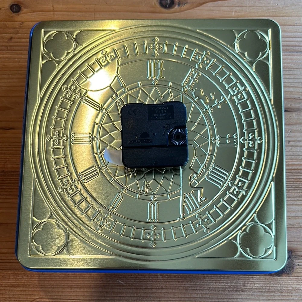 Marks and Spencer Blue and White Tin Clock